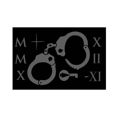 Illustration of handcuffs with Roman numerals and a key on a black background, similar to the Patch - GORUCK TRIBE - 2022 from an exclusive subscription.