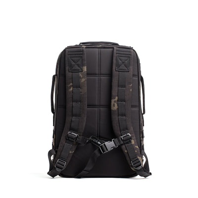 The black and camo Rucker 4.0 backpack, shown from the back, features padded straps and a chest buckle for optimal comfort while rucking.