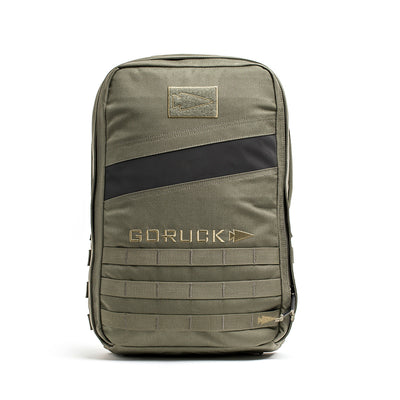 The Rucker 4.0 is a green tactical rucksack with a black diagonal stripe and "GORUCK" logo, designed for rucking with multiple compartments and MOLLE webbing for versatile storage.