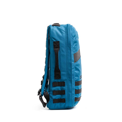 Side view of the Rucker 4.0, a blue rucksack with black straps and handles, ideal for rucking enthusiasts.