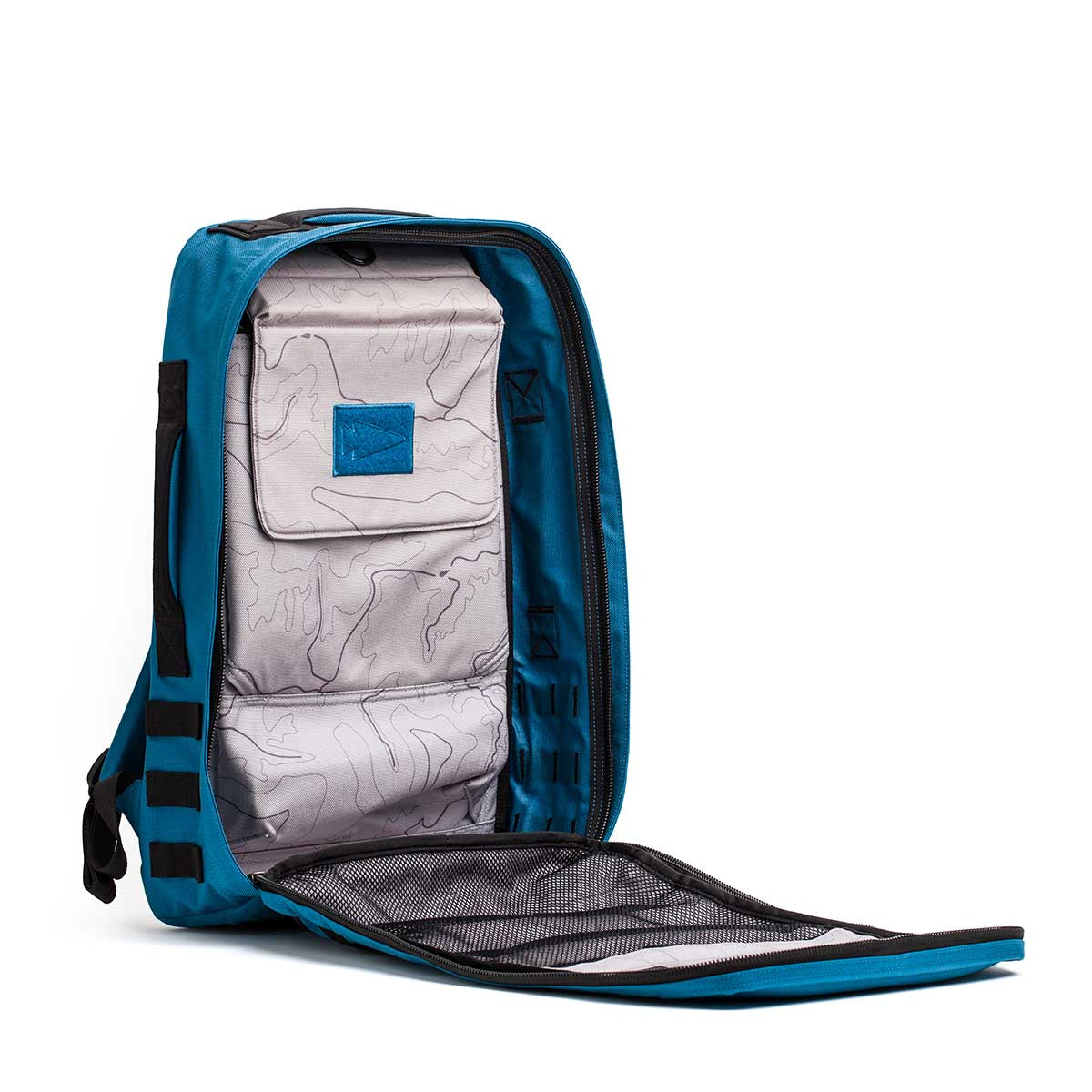 The Rucker 4.0 is an open blue rucksack with a topographic inner lining, ideal for rucking. It includes multiple compartments and straps to securely hold your essentials, such as a Ruck Plate if needed.