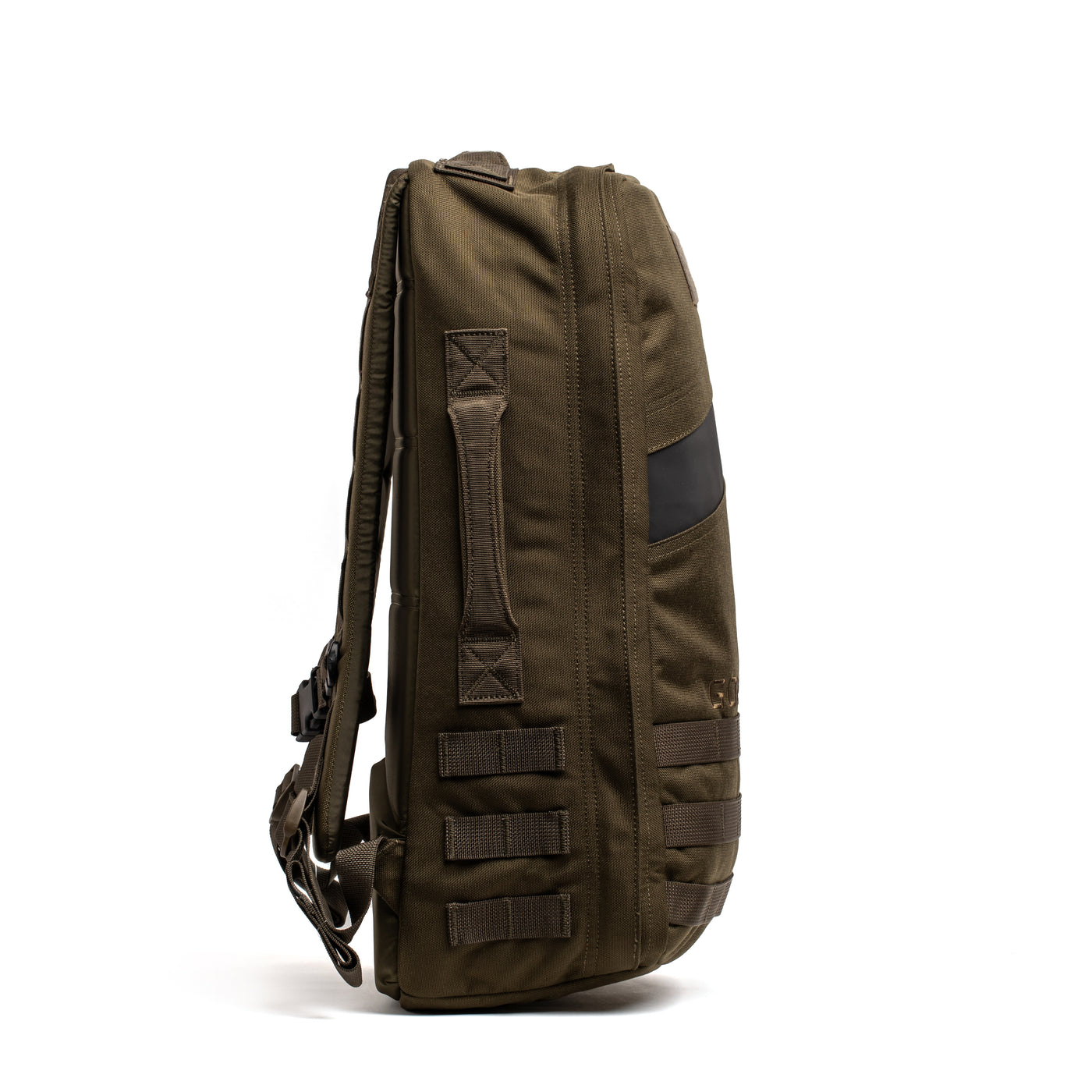 A side profile of the khaki green Rucker 4.0 rucksack by GORUCK, showcasing its multiple compartments, straps, and buckles. The robust design is ideal for rucking and various outdoor adventures. The bag is upright against a white background.