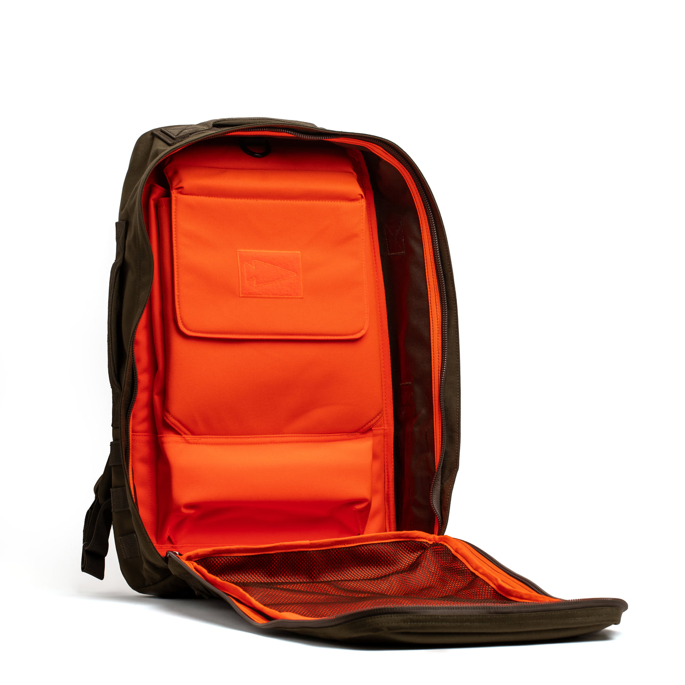 Introducing the Rucker 4.0 by GORUCK: This open olive green rucksack, featuring a vibrant bright orange interior, offers a structured design perfect for rucking. It includes multiple compartments and a mesh pocket on the flap for ample storage space. The exterior pocket has a flap embellished with GORUCK’s signature small triangle logo.