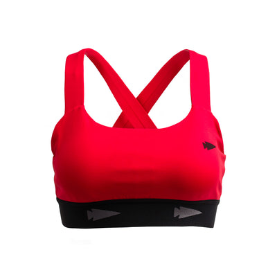 Introducing the GORUCK Power Bra - Toughflex: a vibrant red sports bra featuring crisscross straps and a black band adorned with arrow designs. Designed from ToughStretch Fabric, this bra is perfect for high-impact movements. Its sleek, modern appearance stands out against a plain white background.