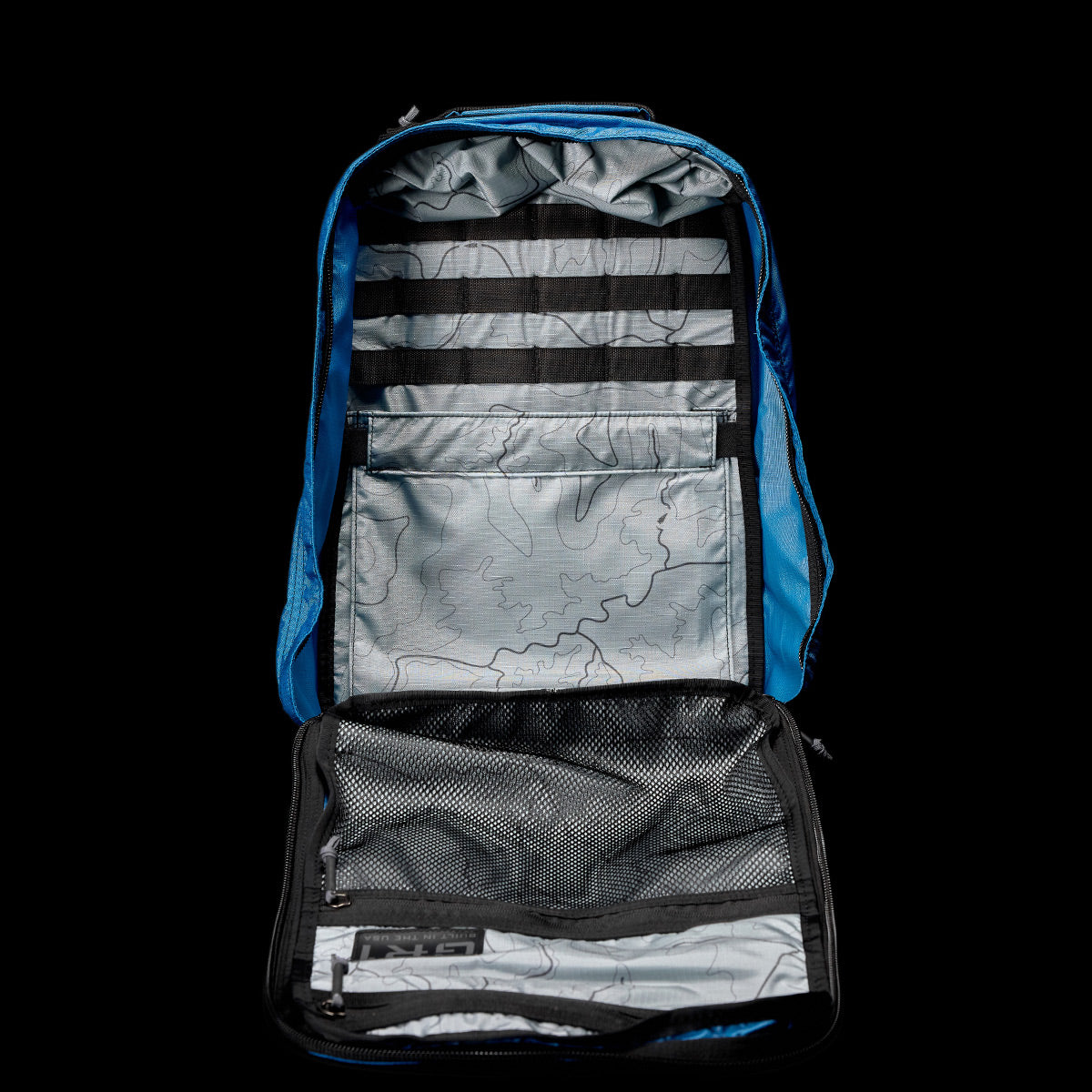 Check out the GORUCK GR1 USA - Ripstop ROBIC®, a blue backpack that boasts an ultra-lightweight design, multiple compartments, and a topographical map lining, all crafted from water-resistant Ripstop Nylon.