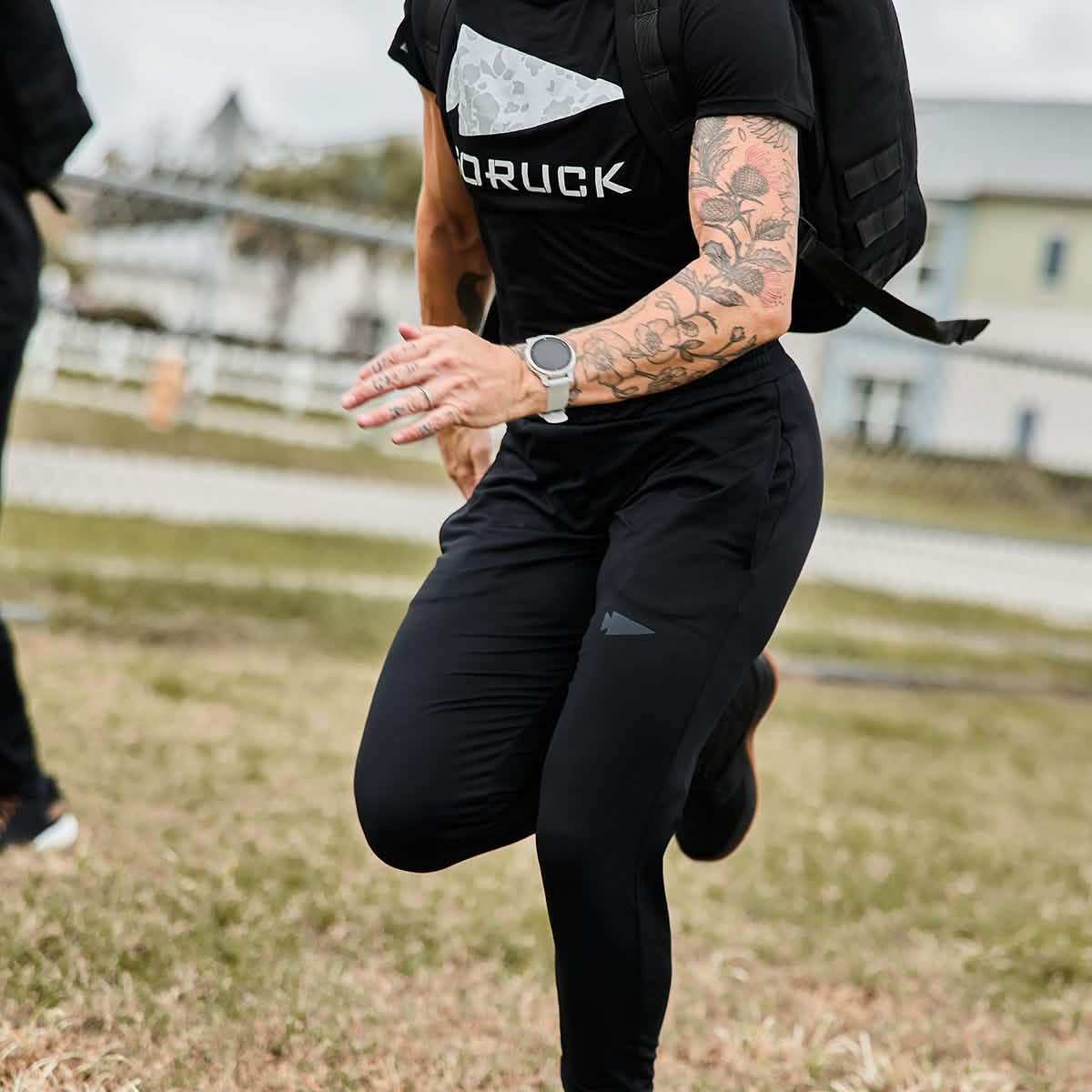 Detail shot of a woman exercising outdoors, Woman is wearing Women's Performance Joggers.