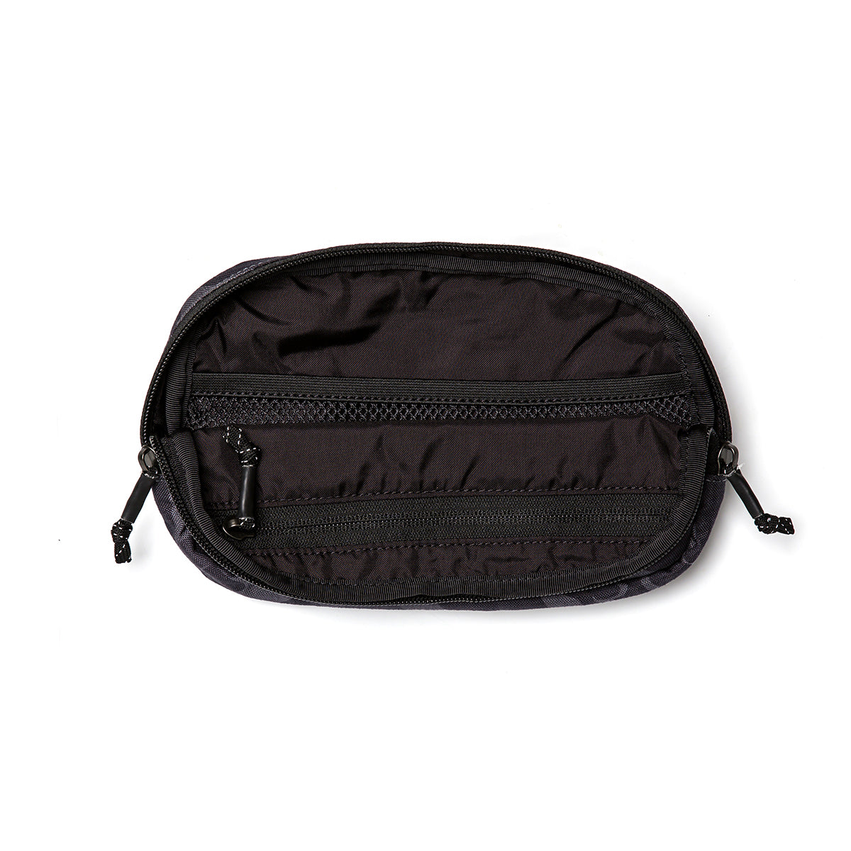 A compact, oval-shaped pouch in black is open, showcasing its neatly organized interior. This GORUCK Belt Bag includes two zippered sections—one larger and one smaller—with matching black zippers and pull tabs. It rests against a stark white background and offers versatile wear with its adjustable webbing strap.