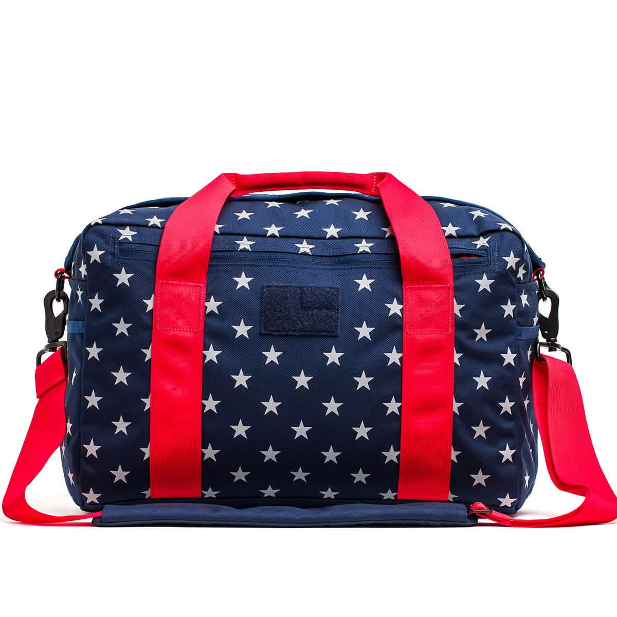 A blue Kit Bag (Includes Shoulder Strap) with white stars and red handles and straps.