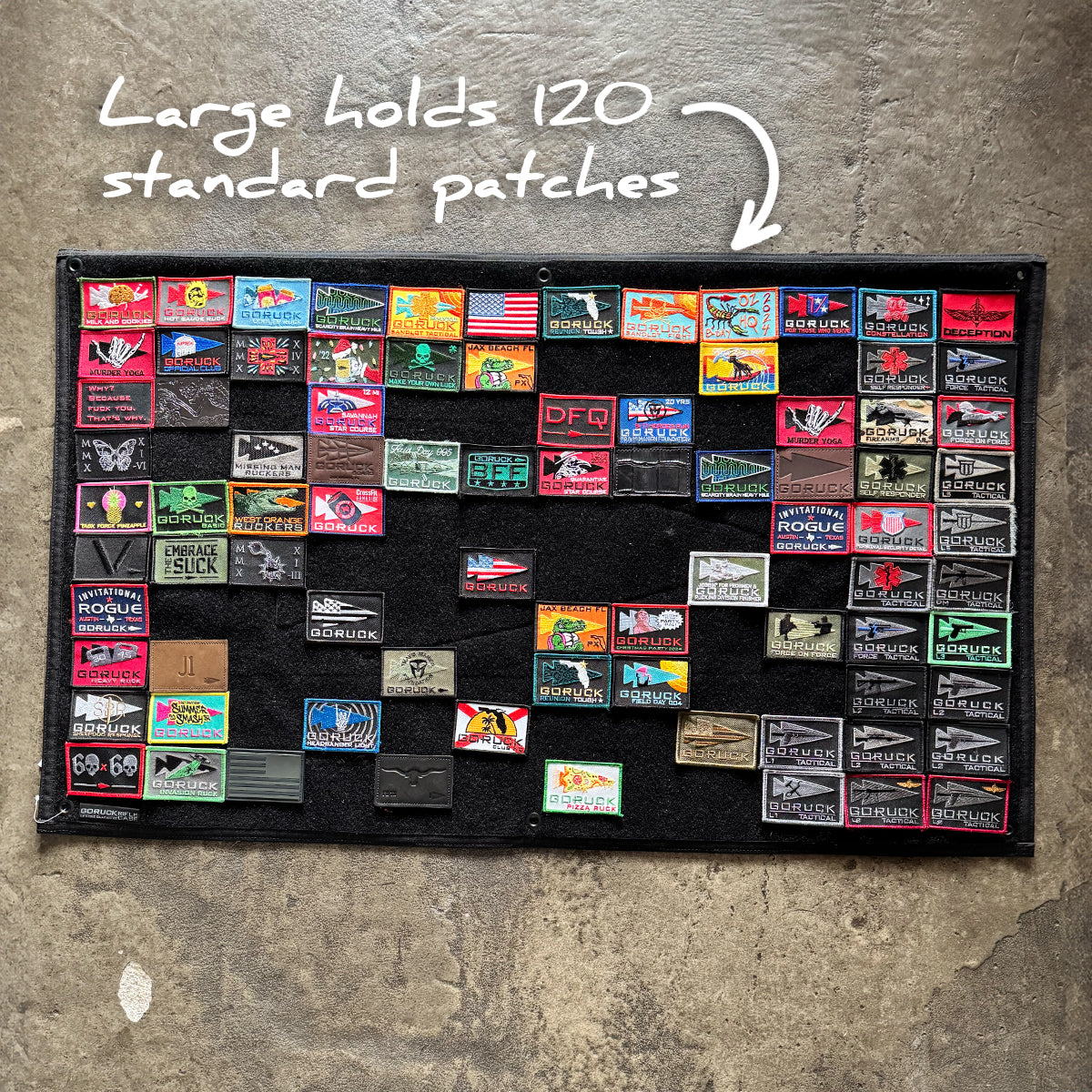 The GORUCK Spearhead Patch Board is a large black Cordura panel showcasing various colorful patches, designed to hold up to 120 standard patches.