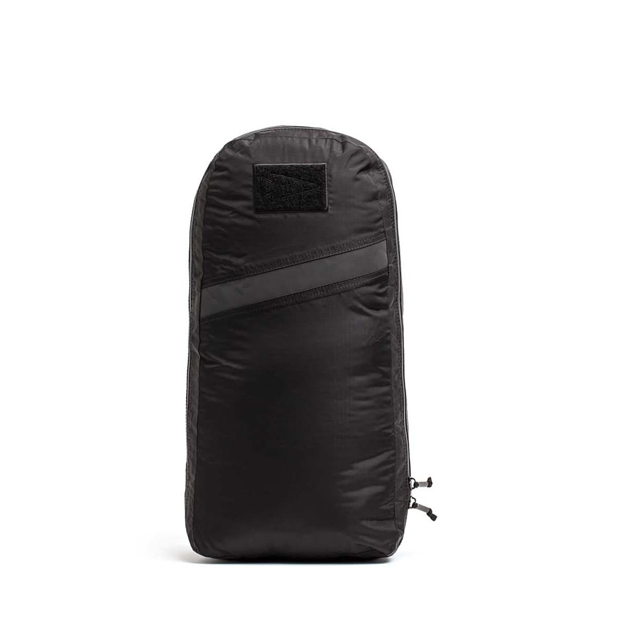 The black Packable Bullet Ruck - Ripstop ROBIC® backpack offers enhanced durability with its sleek design, top handle, dual zippers, and a subtle diagonal stripe on the front.