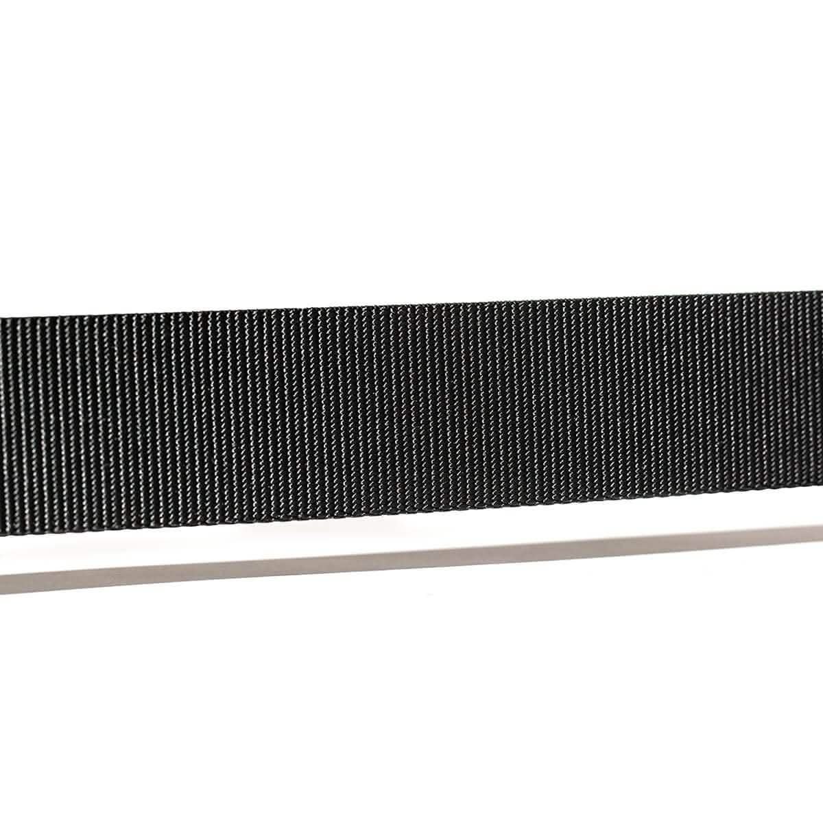 Close-up of a USA Made black flexible ribbon cable, reminiscent of the fine lines seen on a Grip6 Tribe Tactical Belt, set against a crisp white background.