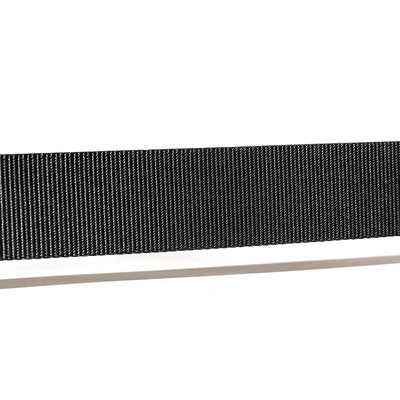 Close-up of a USA Made black flexible ribbon cable, reminiscent of the fine lines seen on a Grip6 Tribe Tactical Belt, set against a crisp white background.