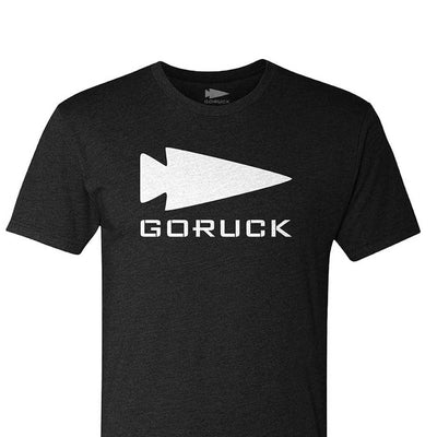 The GORUCK Spearhead Tee - Tri-Blend by vendor-unknown is a high-quality black t-shirt showcasing a striking white spearhead design, referencing its Special Forces heritage with an arrowhead above the name.